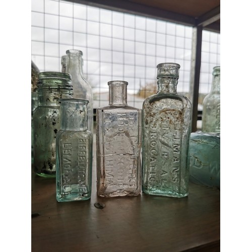 25 - Large quantity 46x of vintage and antique glass bottles some are branded Couchs Whooping Cough and A... 