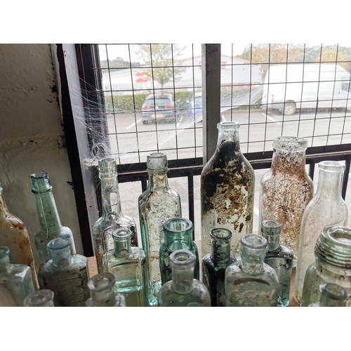 25 - Large quantity 46x of vintage and antique glass bottles some are branded Couchs Whooping Cough and A... 