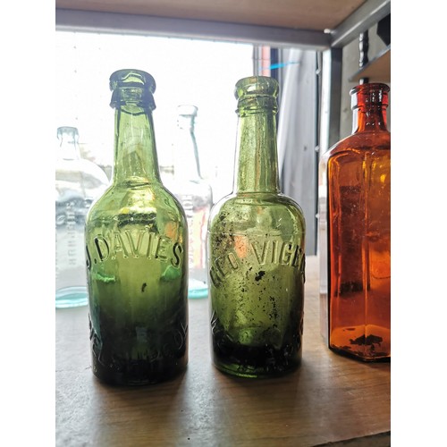 27 - Quantity of 11 vintage glass bottles of varying sizes and brands inc 2x Welshpool bottles, Cornbrook... 