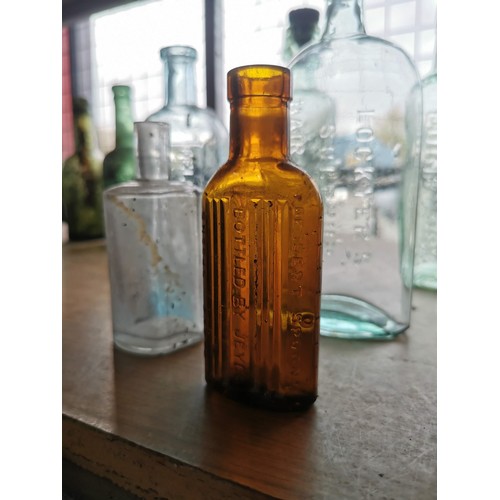 27 - Quantity of 11 vintage glass bottles of varying sizes and brands inc 2x Welshpool bottles, Cornbrook... 