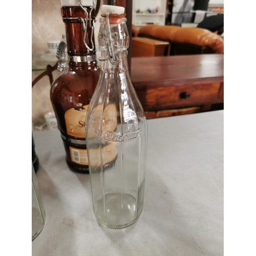 34 - Large quantity of bottles inc 5x Il Casolare bottles, 2x unbranded fizzy bottles 2x Montys large bee... 