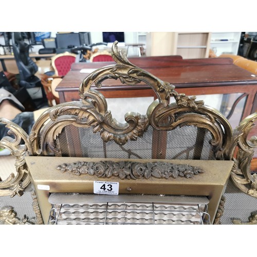 43 - Good quality vintage ornate brass electric belling fire with a cherub design on scroll feet. 70cm hi... 