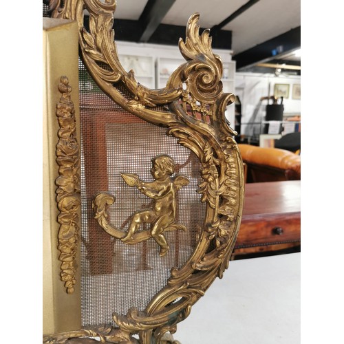 43 - Good quality vintage ornate brass electric belling fire with a cherub design on scroll feet. 70cm hi... 