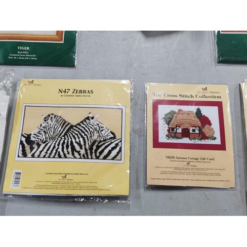 48 - 10 packets of new counted crossstich of various picture designs inc swan, zebra, buildings, birds et... 