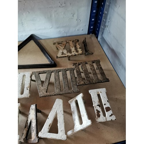 69 - Quantity of cast iron roman numerals possibly from an outdoor clock,  along with a cast iron triangl... 