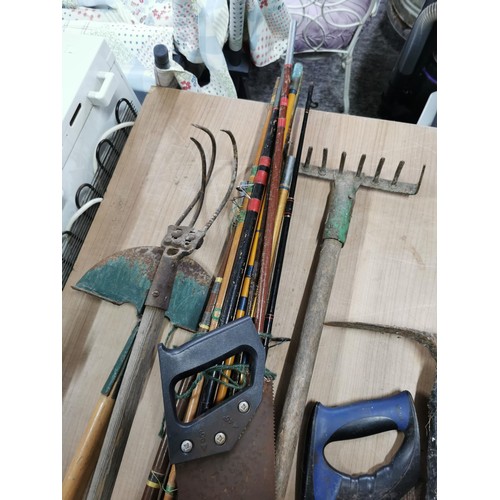 83 - Galvanized bin containing a quantity of vintage tools inc rake, pick axe, lawn edger, hand saw along... 