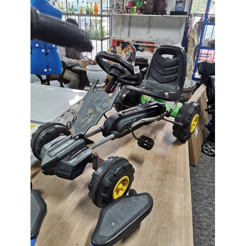 84 - Child's metal swing scooter along with a Batman childs pedal cart