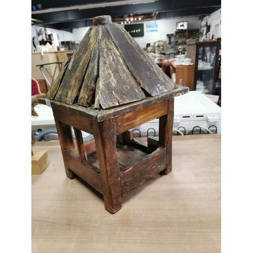 112 - Well made wooden hanging bird table along with 2x terracotta garden figures on wooden bases, bird ta... 