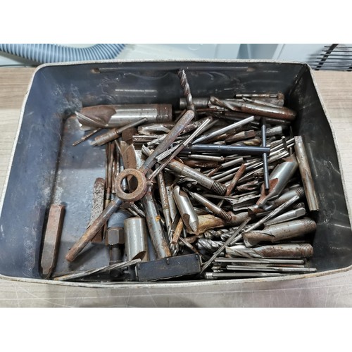 117 - A large quantity of engineering tools to include tap and dies, drill bits, augers etc