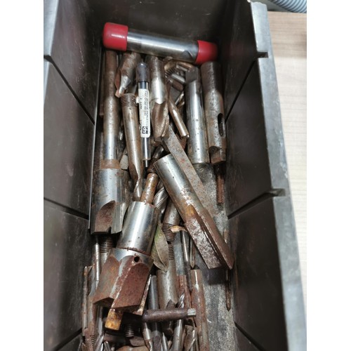 117 - A large quantity of engineering tools to include tap and dies, drill bits, augers etc