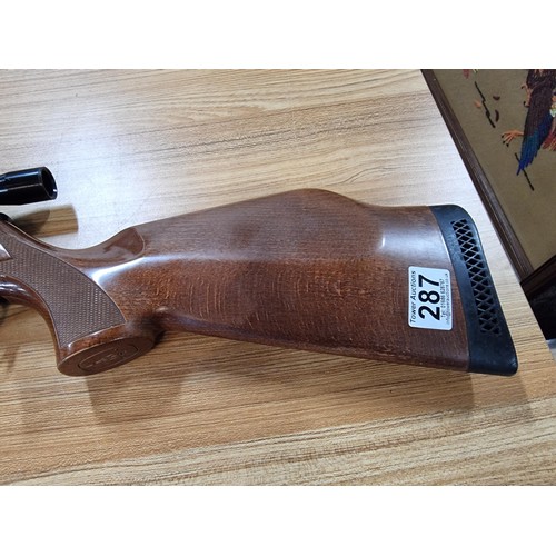 287 - A vintage good quality BSA .22 air rifle with a silencer fitted along with Nikko stirling silver cro... 