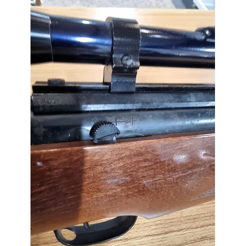 287 - A vintage good quality BSA .22 air rifle with a silencer fitted along with Nikko stirling silver cro... 