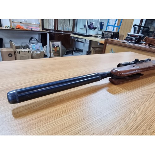 287 - A vintage good quality BSA .22 air rifle with a silencer fitted along with Nikko stirling silver cro... 