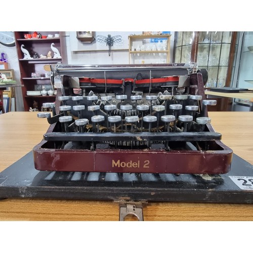 289 - A vintage 1925 bar/let mode 2 portable typewriter by John Jardine, in good vintage condition with bl... 