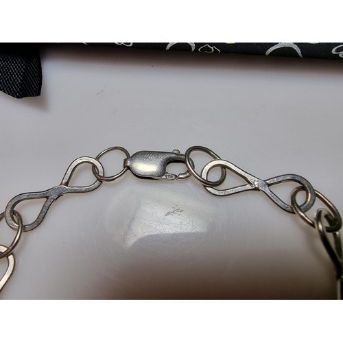 315 - A 925 silver bracelet with an infinity symbol link design, in good clean condition and boxed. Length... 