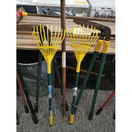 132 - Large collection of garden tools inc lawn edgers, rakes, garden brush etc