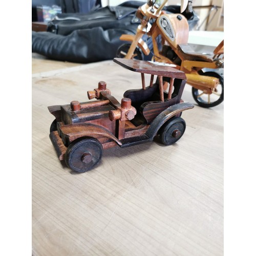 156 - Collection of 3x wooden fair trade ornamental items inc 2x motorbikes and one car, motorbikes measur... 