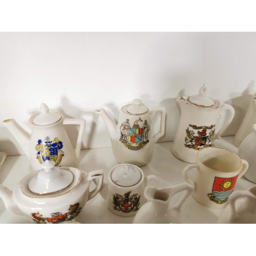 161 - Large quantity of miniature W.H. Goss inc teapots, cups and saucers, cheese domes, jugs etc from Str... 