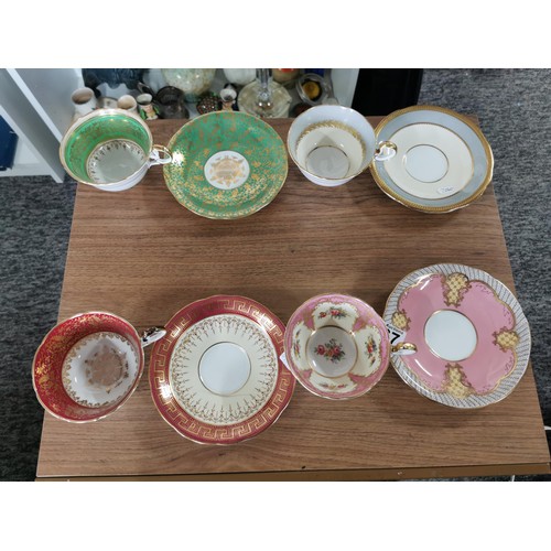 167 - Collection of 4x multi coloured cup and saucer sets, the red and gilded set has a hairline crack to ... 