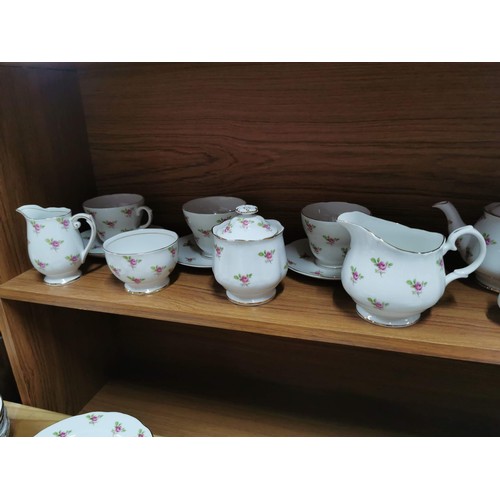 175 - Quantity of rosebud pattern dinner sets and tea sets, inc cups saucers cake plate, teapot, milk jug,... 