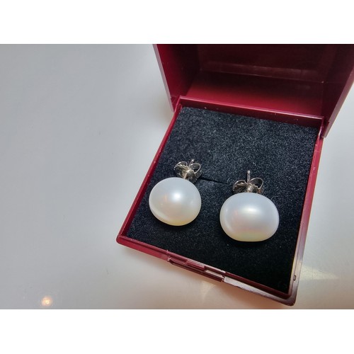 333 - A pair of large genuine pearl 925 silver stud earrings in as new condition, never had any use. diame... 