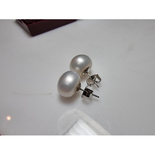 333 - A pair of large genuine pearl 925 silver stud earrings in as new condition, never had any use. diame... 