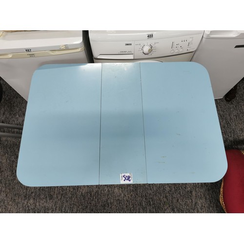 508 - Drop leaf 1970's blue formica topped table in overall good condition height 76cm, 90cm wide with lea... 