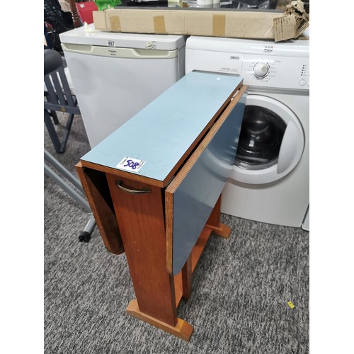 508 - Drop leaf 1970's blue formica topped table in overall good condition height 76cm, 90cm wide with lea... 