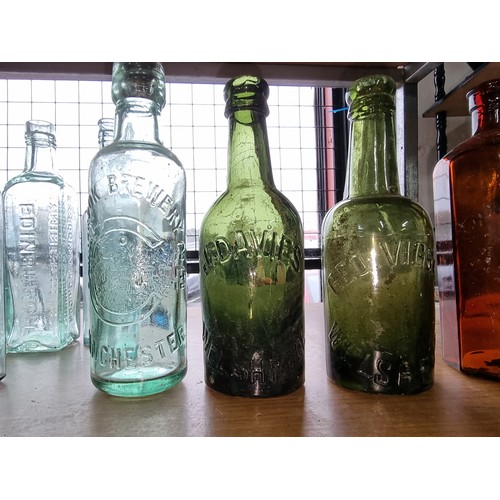 27 - Quantity of 11 vintage glass bottles of varying sizes and brands inc 2x Welshpool bottles, Cornbrook... 