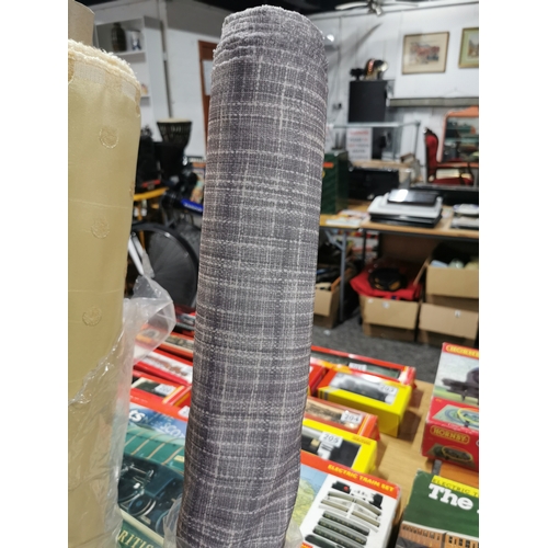 56A - 3x rolls of various length of fabric inc thick blue roll of fabric, yellow dotted fabric and a grey ... 