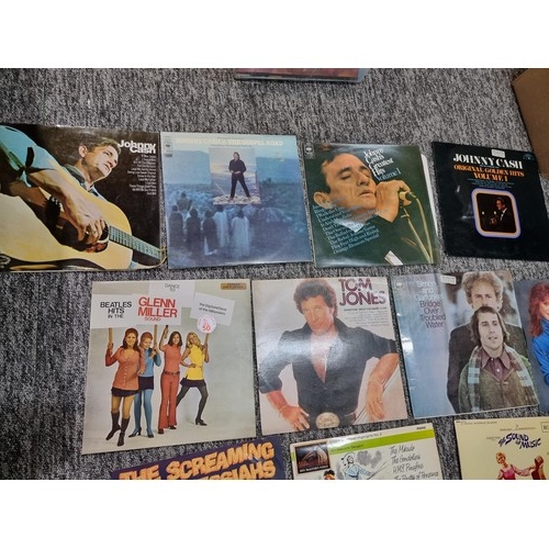 235 - A box full of various LP vinyl records to include Jonny Cash , Glenn Miller, Tom Jones, Simon and Ga... 