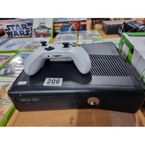 206 - A comprehensive Xbox 360 gaming console bundle to include an Xbox 360, 12 good games, a boxed turtle... 