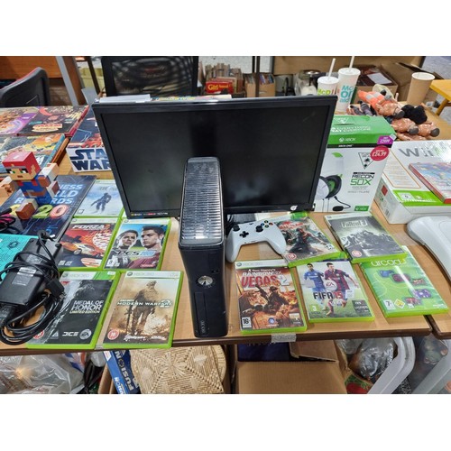 206 - A comprehensive Xbox 360 gaming console bundle to include an Xbox 360, 12 good games, a boxed turtle... 