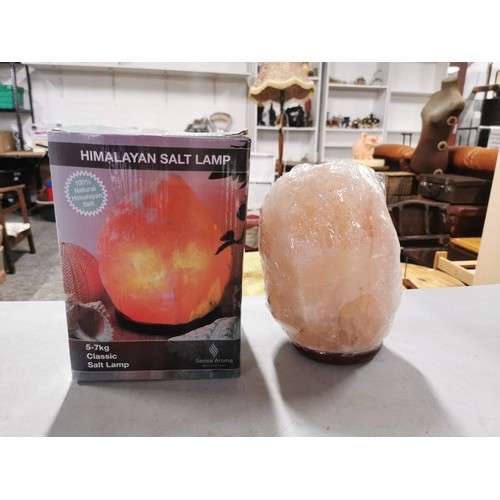 25 - Himalayan salt lamp on wooden base as new, lamp weighs 3-5kg