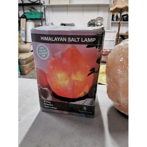 25 - Himalayan salt lamp on wooden base as new, lamp weighs 3-5kg