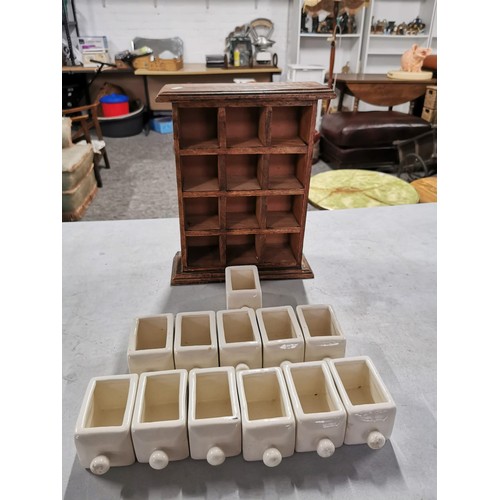 26 - 12 division wooden spice rack containing 12 ceramic holders in good order height 32cm by 22cm as new