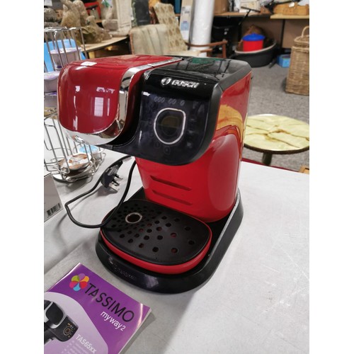 27 - Bosch red Tassimo coffee machine with new water filter complete with some drink pods and pod storage... 