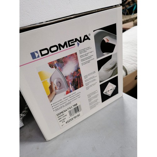 56 - Domena steam iron on base in as new condition complete with instructions power cable etc