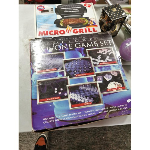 64 - Games compendium 6 in one, along with magic ball light, ball light, mircowave grill, clock, money bo... 