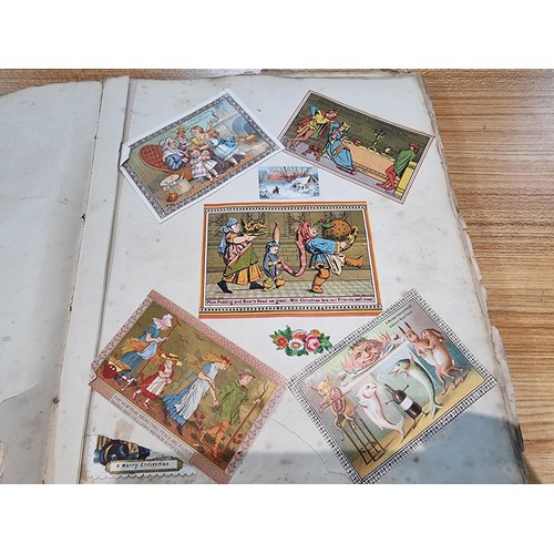236 - A good scrap album complete to the end filled with mostly  early vintage Christmas and greeting card... 