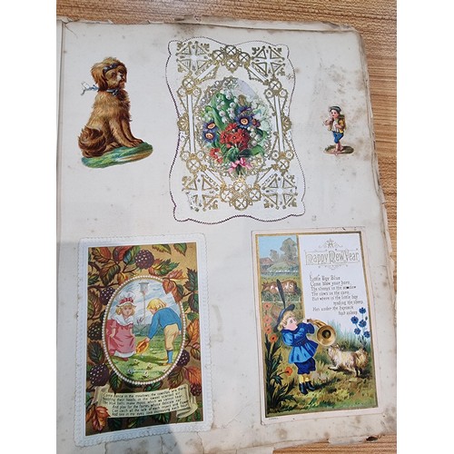 236 - A good scrap album complete to the end filled with mostly  early vintage Christmas and greeting card... 