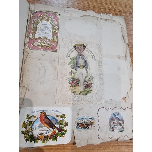 236 - A good scrap album complete to the end filled with mostly  early vintage Christmas and greeting card... 