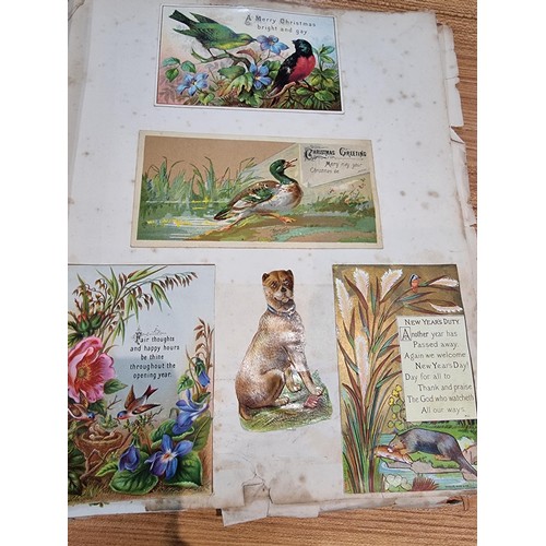 236 - A good scrap album complete to the end filled with mostly  early vintage Christmas and greeting card... 