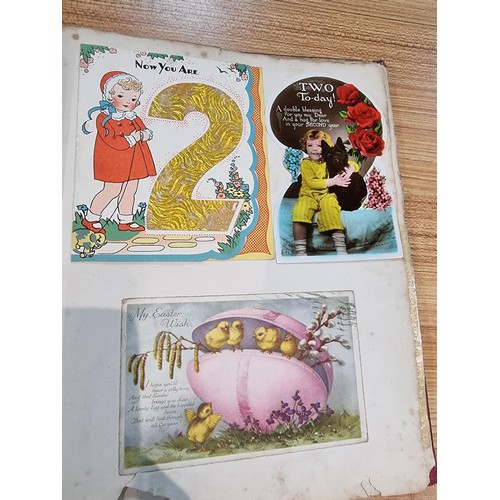 236 - A good scrap album complete to the end filled with mostly  early vintage Christmas and greeting card... 
