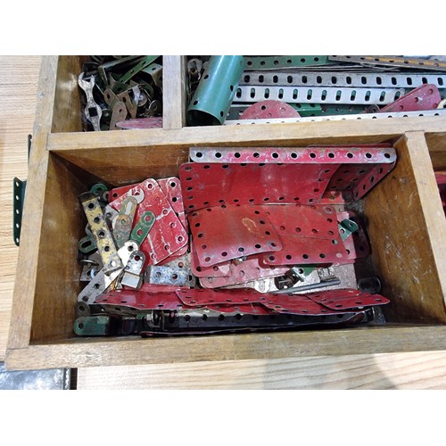 240 - A box containing a large quantity of vintage Meccano to include some rare pieces, please study the p... 