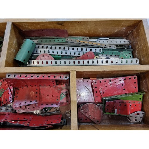 240 - A box containing a large quantity of vintage Meccano to include some rare pieces, please study the p... 