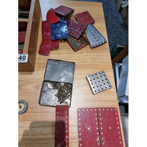 240 - A box containing a large quantity of vintage Meccano to include some rare pieces, please study the p... 