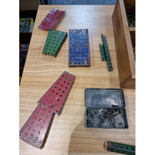 240 - A box containing a large quantity of vintage Meccano to include some rare pieces, please study the p... 