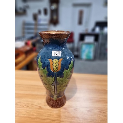 253 - A large antique impressive Belgian glazed vase featuring an incised art nouveau thistle design, made... 