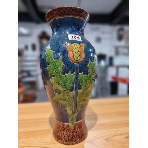 253 - A large antique impressive Belgian glazed vase featuring an incised art nouveau thistle design, made... 